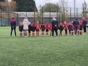 Players observe a minute’s silence before kick-off on Remembrance Sunday.